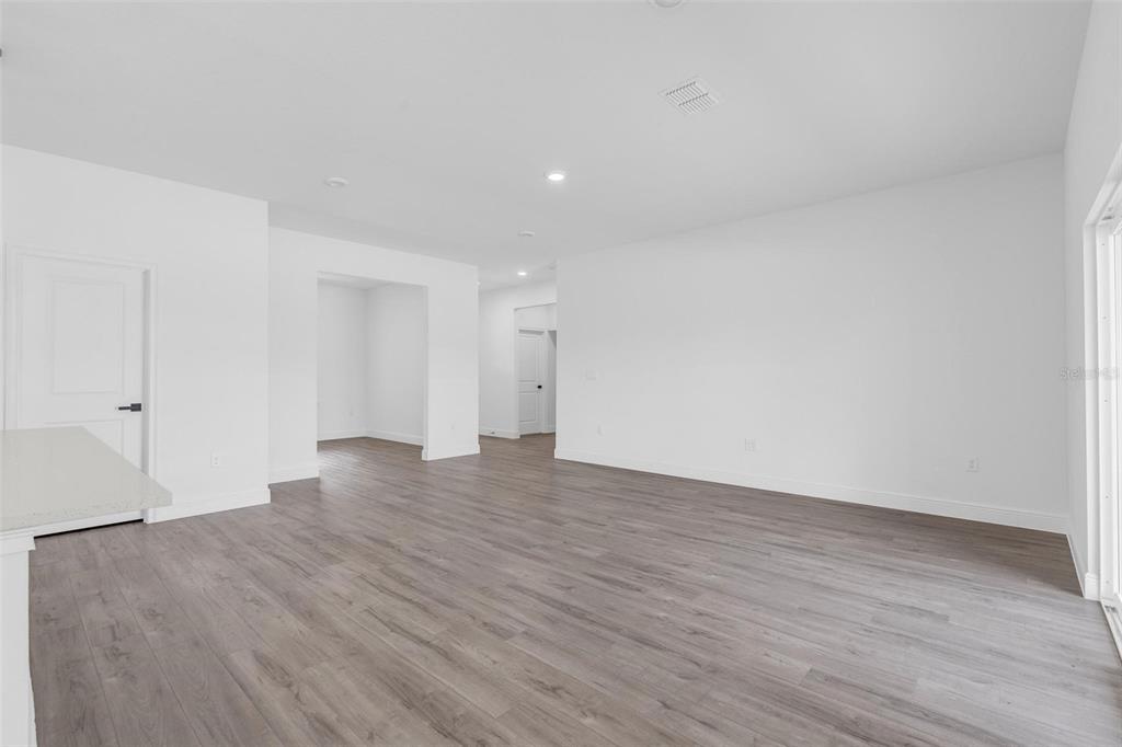 17109 Southwest 41st Circle Ocala, FL 34473 - Photo 28 of 72 a view of an empty room with wooden floor