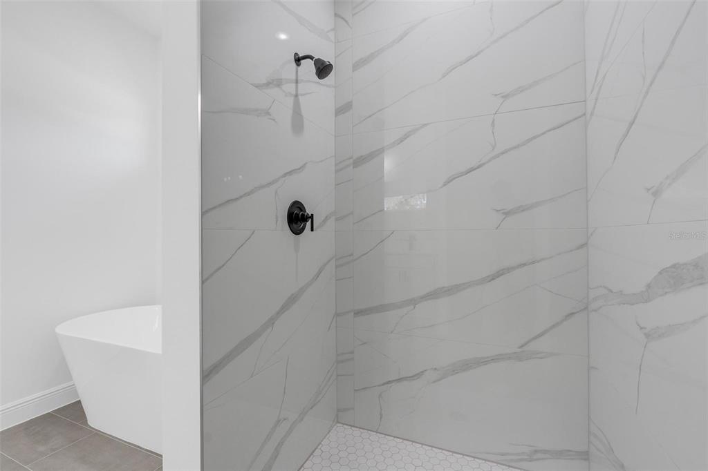 17109 Southwest 41st Circle Ocala, FL 34473 - Photo 34 of 72 a bathroom with a shower