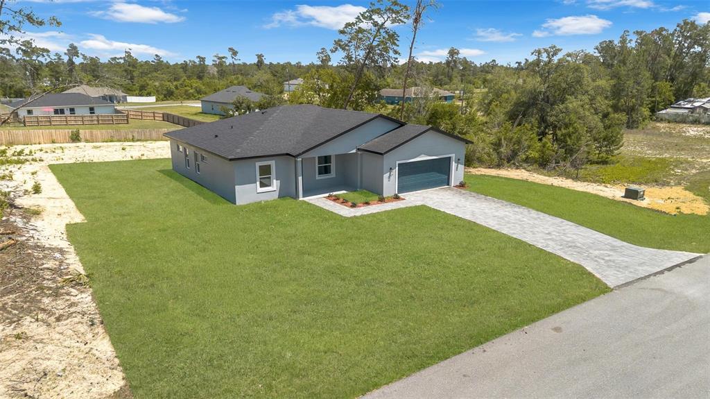 17109 Southwest 41st Circle Ocala, FL 34473 - Photo 4 of 72 an aerial view of residential houses with outdoor space and trees
