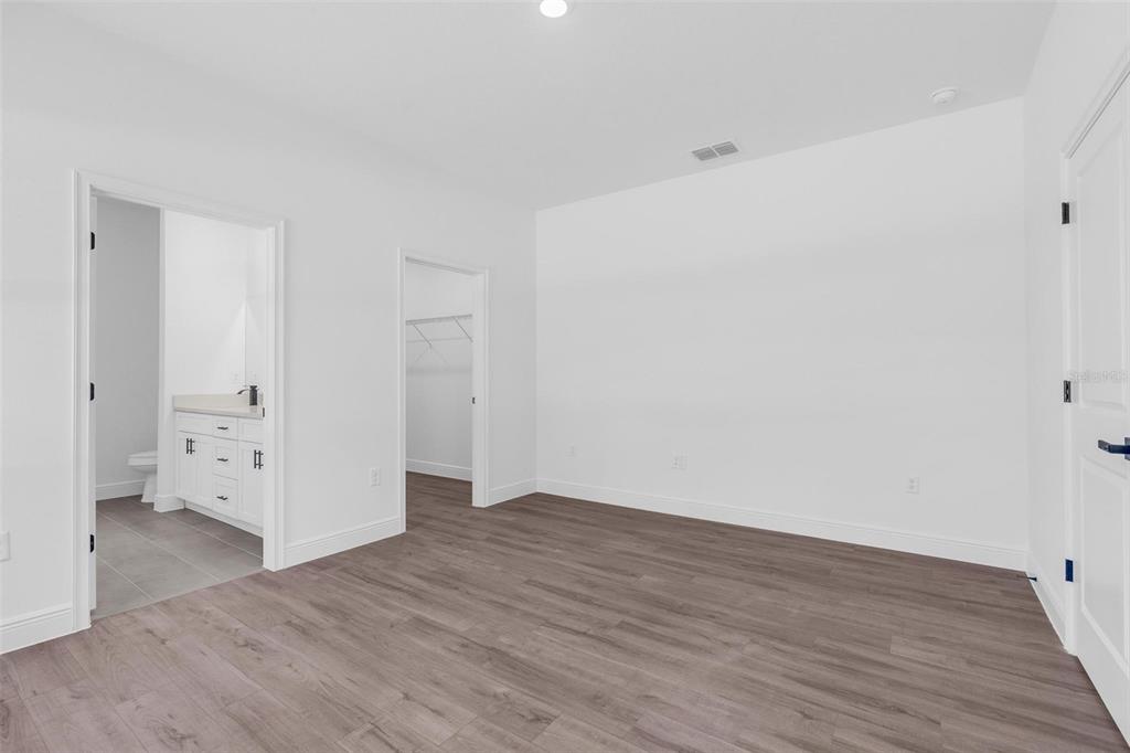 17109 Southwest 41st Circle Ocala, FL 34473 - Photo 44 of 72 wooden floor in an empty room