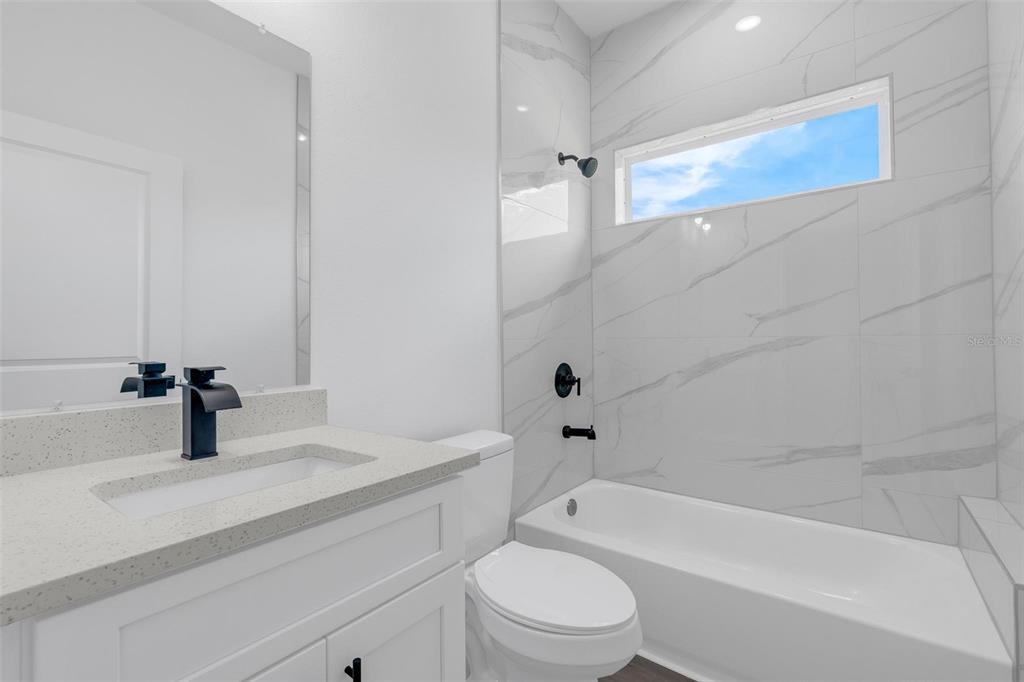 17109 Southwest 41st Circle Ocala, FL 34473 - Photo 46 of 72 a bathroom with a sink a toilet and a bathtub