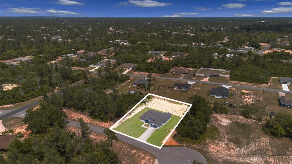 17109 Southwest 41st Circle Ocala, FL 34473 - Photo 57 of 72 an aerial view of residential houses with city view