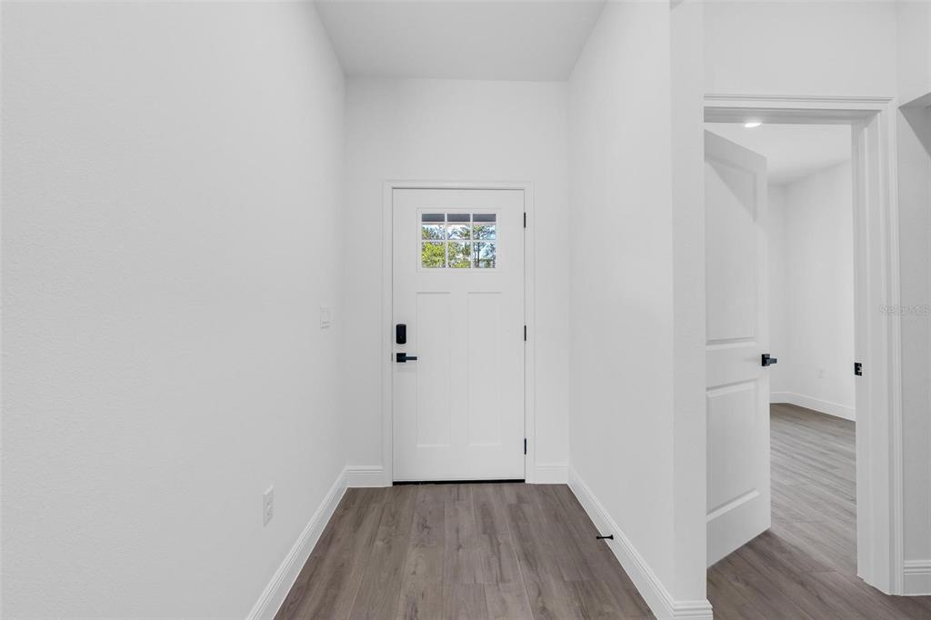17109 Southwest 41st Circle Ocala, FL 34473 - Photo 6 of 72 a view of a room with wooden floor