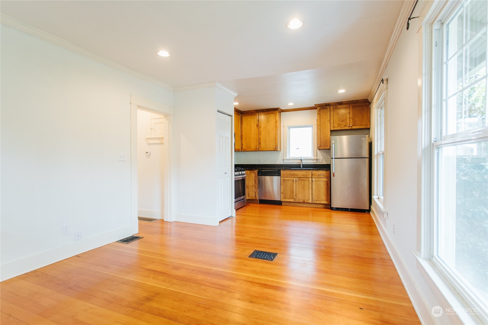 4122 Whitman Avenue North Seattle, WA 98103 - Photo 15 of 28 a view of a kitchen with wooden floor and a refrigerator