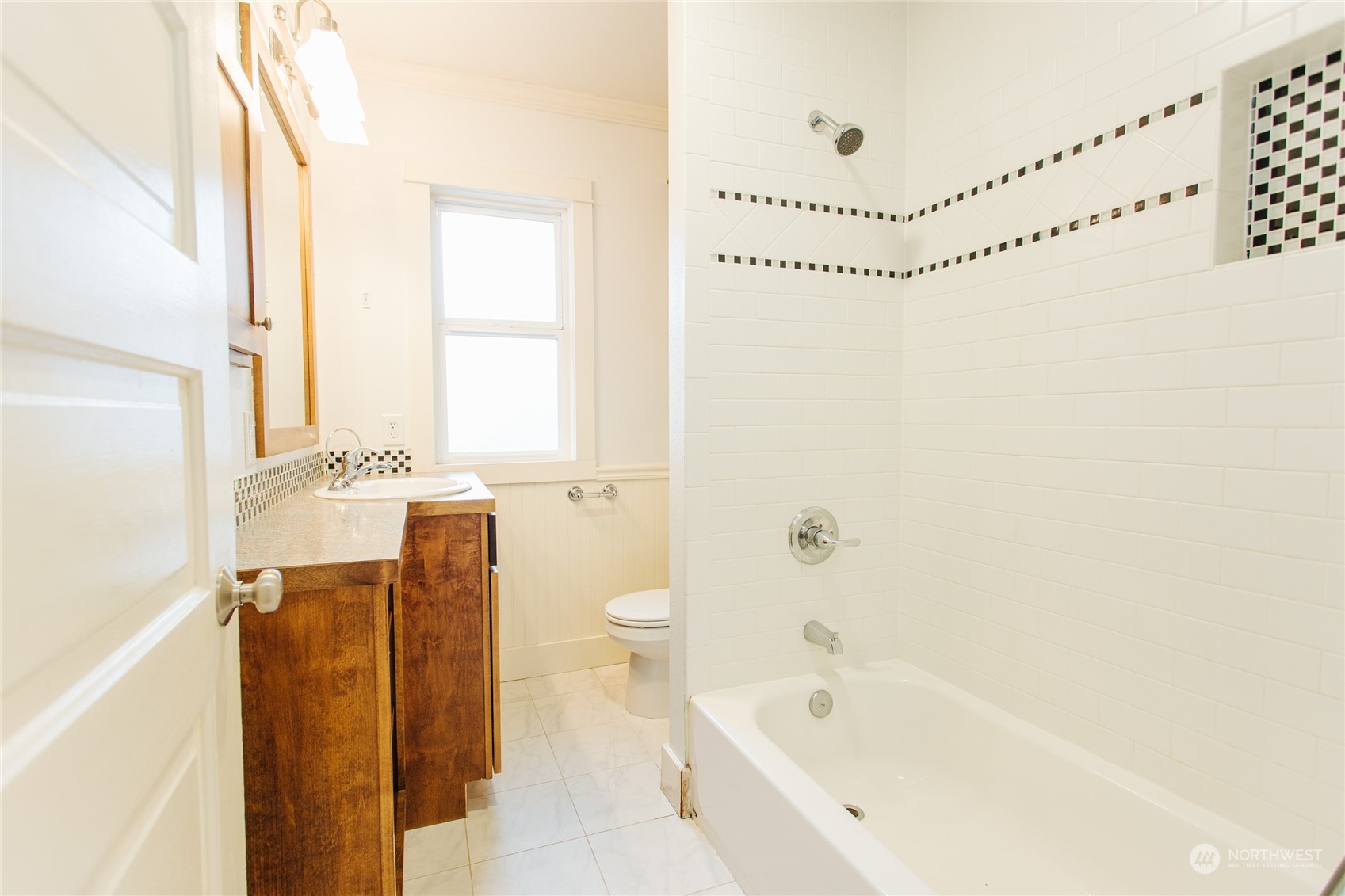 4122 Whitman Avenue North Seattle, WA 98103 - Photo 17 of 28 a bathroom with a bathtub a sink and a shower