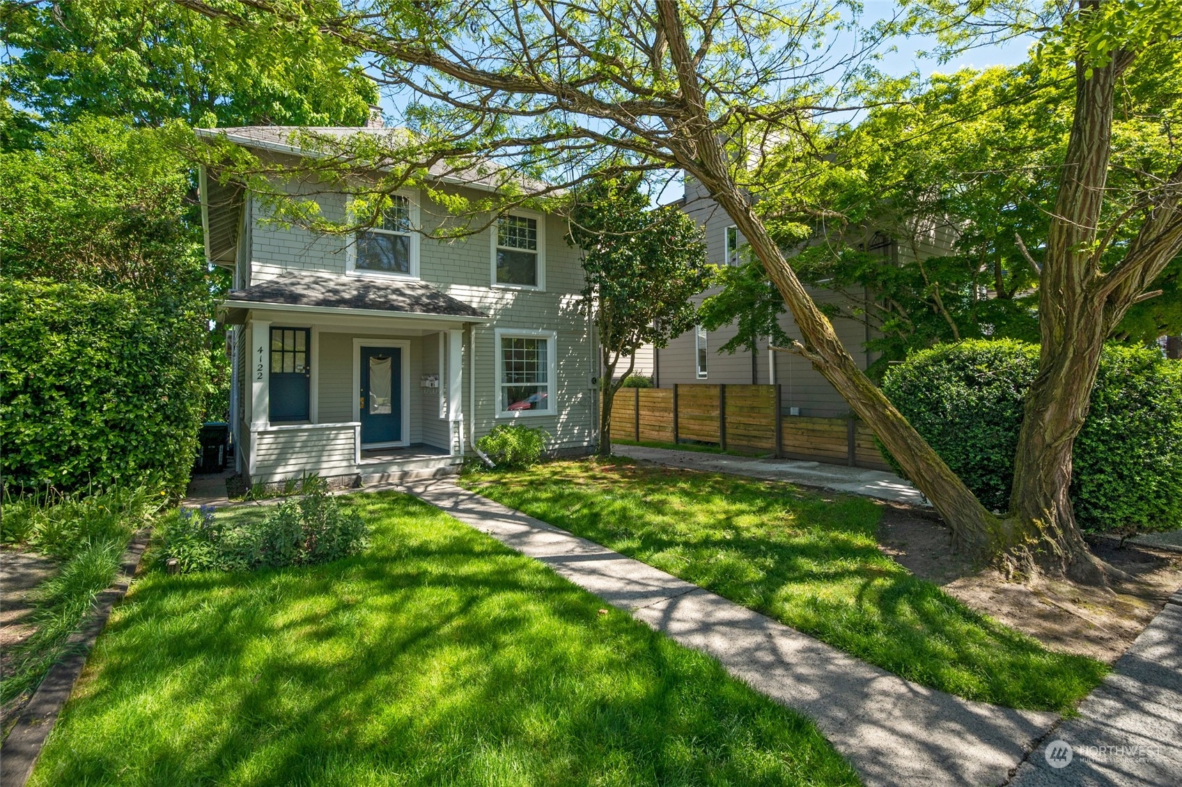 4122 Whitman Avenue North Seattle, WA 98103 - Photo 2 of 28 a view of a yard in front of house