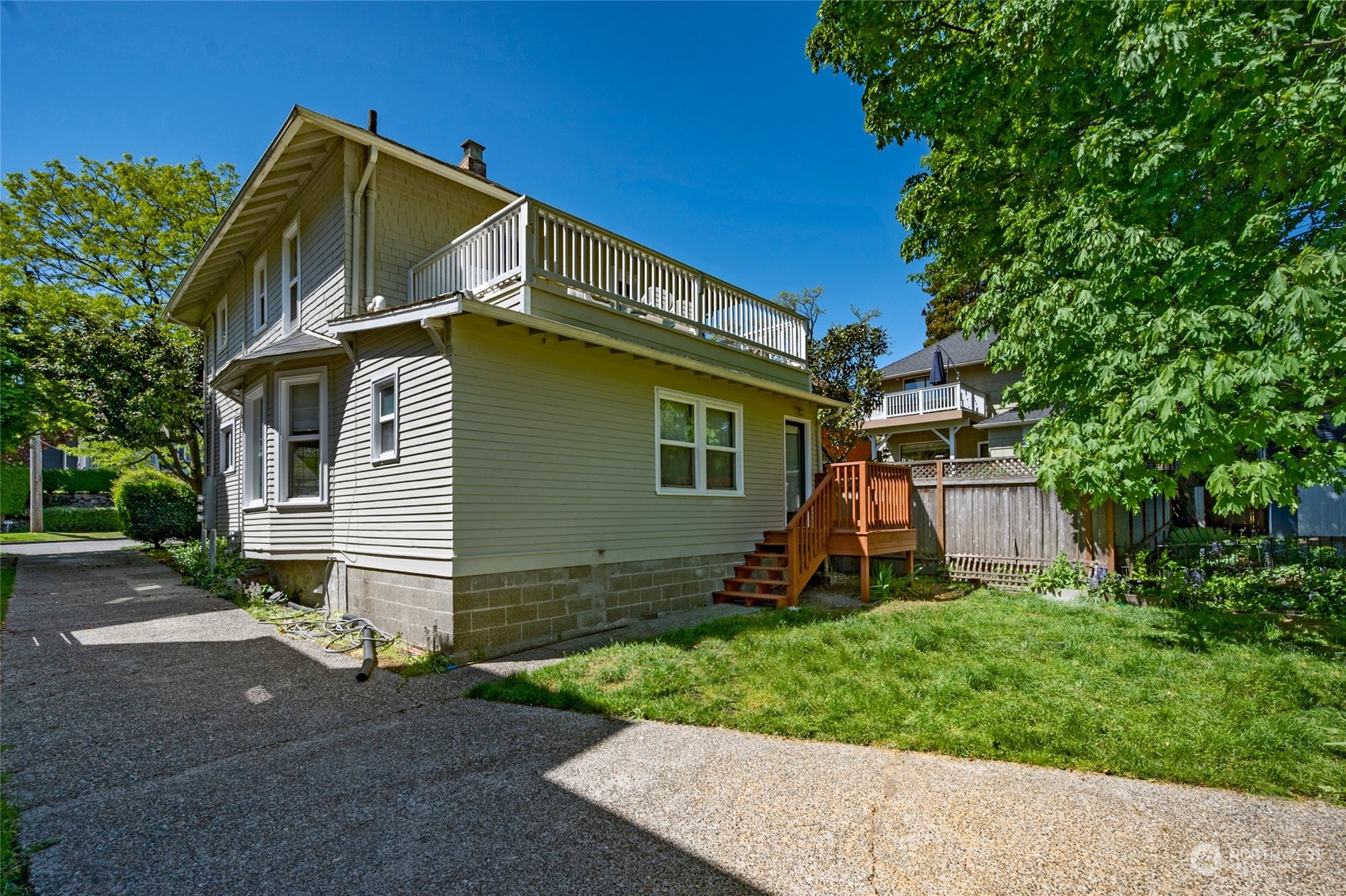 4122 Whitman Avenue North Seattle, WA 98103 - Photo 25 of 28 a view of a house with a yard