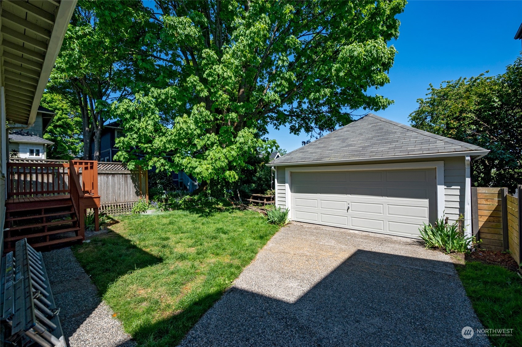 4122 Whitman Avenue North Seattle, WA 98103 - Photo 28 of 28 a front view of a house with a yard and a garage