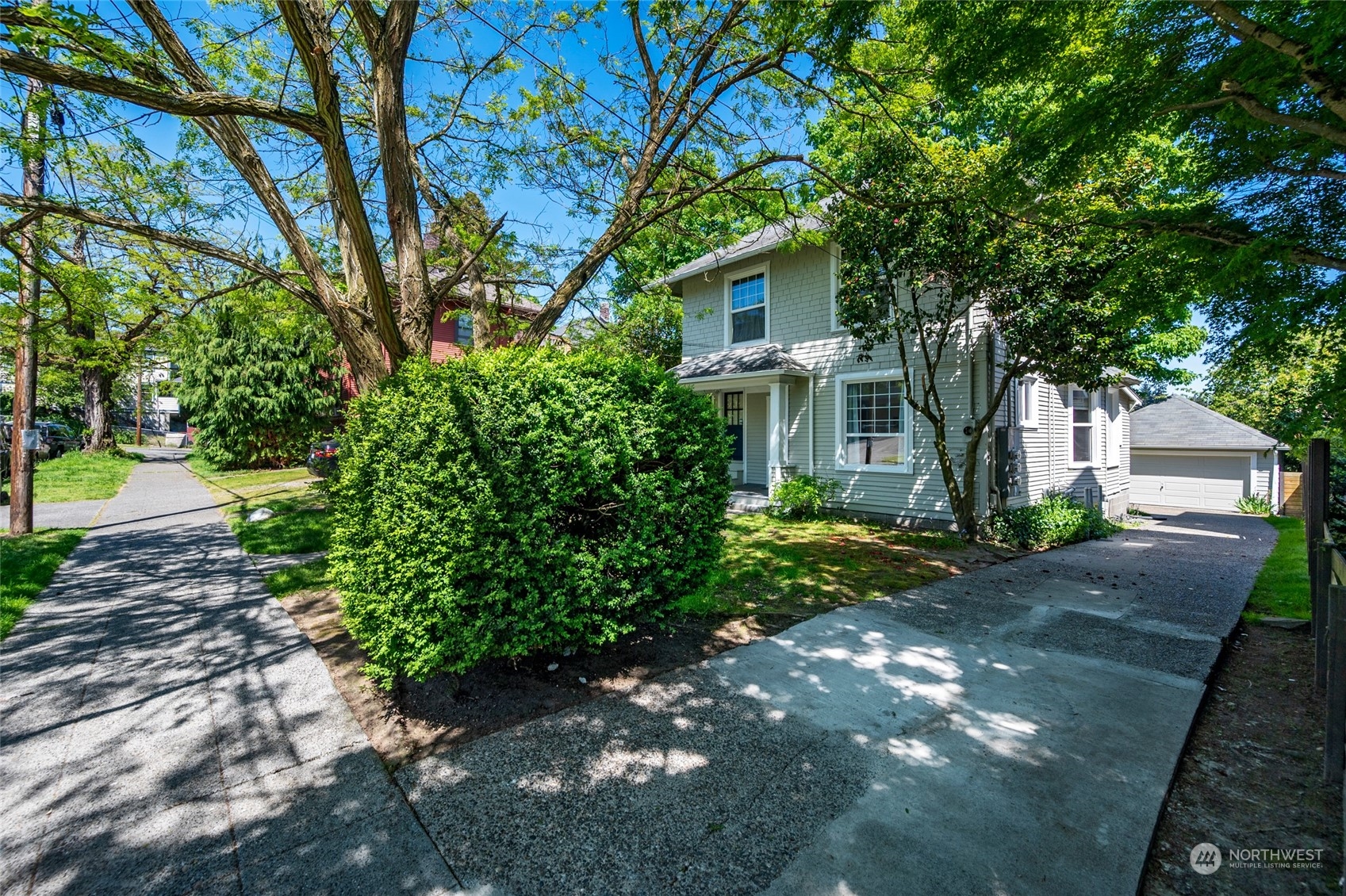 4122 Whitman Avenue North Seattle, WA 98103 - Photo 3 of 28 a front view of a house with garden