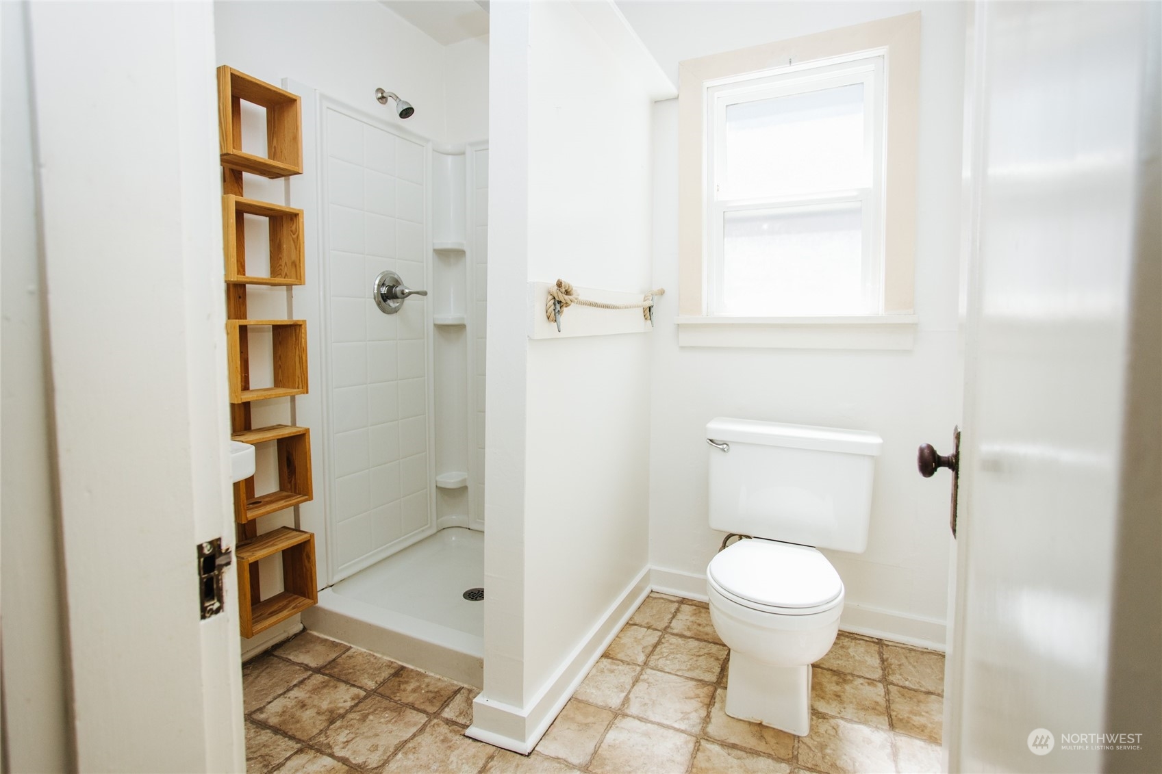 4122 Whitman Avenue North Seattle, WA 98103 - Photo 10 of 28 a bathroom with a toilet and a shower