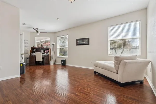 a living room with furniture and a large window