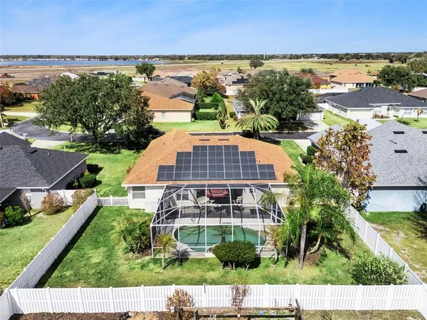 an aerial view of house with yard