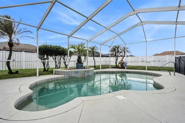 a view of a swimming pool with a patio