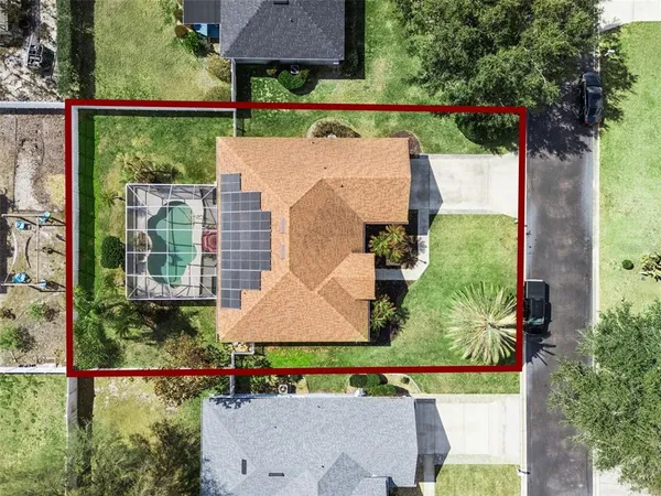 an aerial view of house with yard swimming pool and outdoor seating