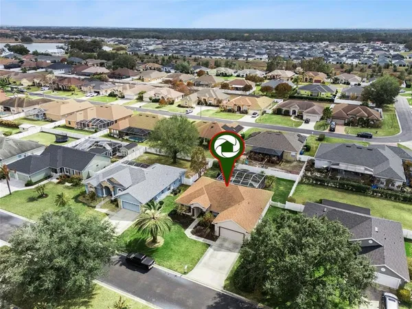 an aerial view of a house with a garden
