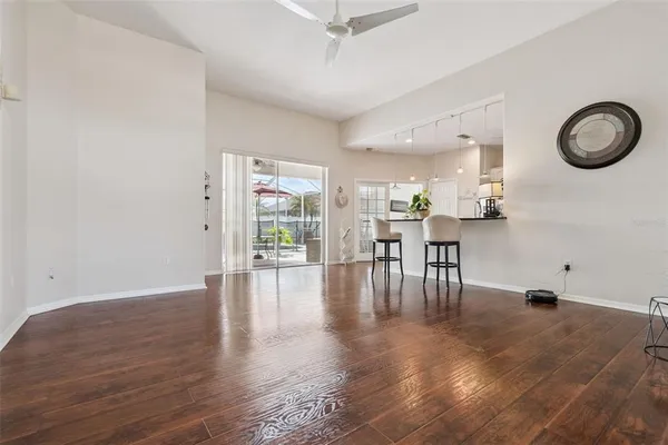a view of dining room with furniture and wooden floor