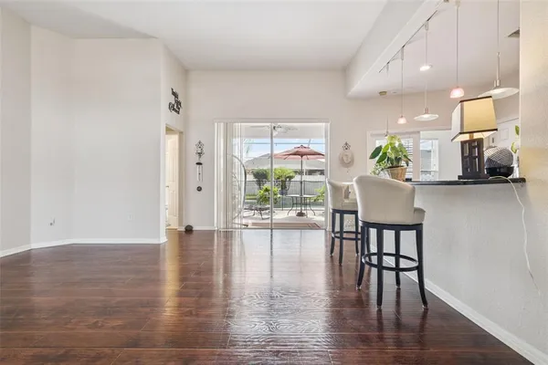 a view of a dining room with furniture window and wooden floor