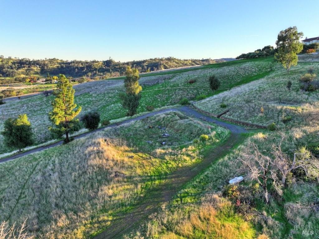 8588 Pleasants Valley Road Winters, CA 95694 - Photo 11 of 18 a view of a pathway both side of grassy field with ocean view