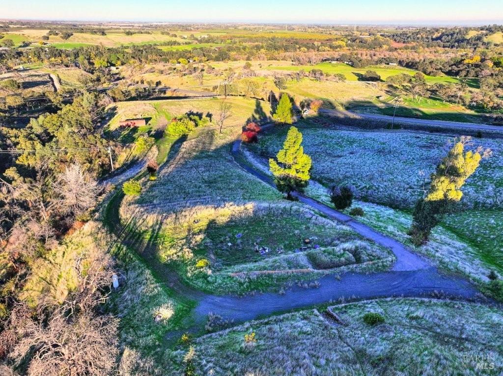8588 Pleasants Valley Road Winters, CA 95694 - Photo 12 of 18 an aerial view of a house with a yard and lake view