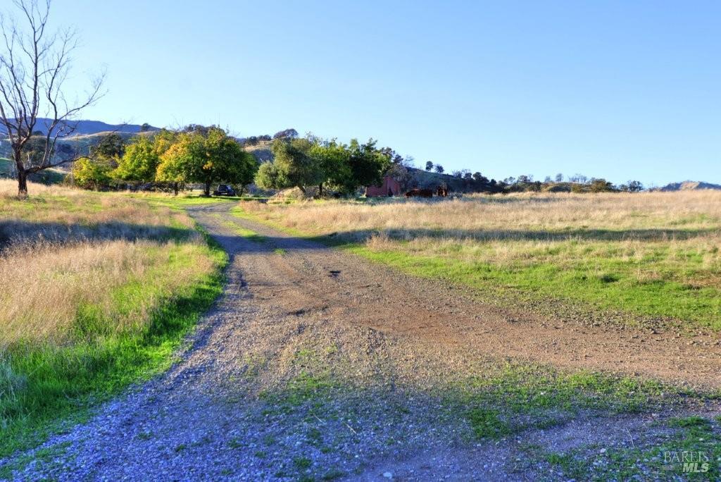 8588 Pleasants Valley Road Winters, CA 95694 - Photo 2 of 18 a view of a lake from a yard