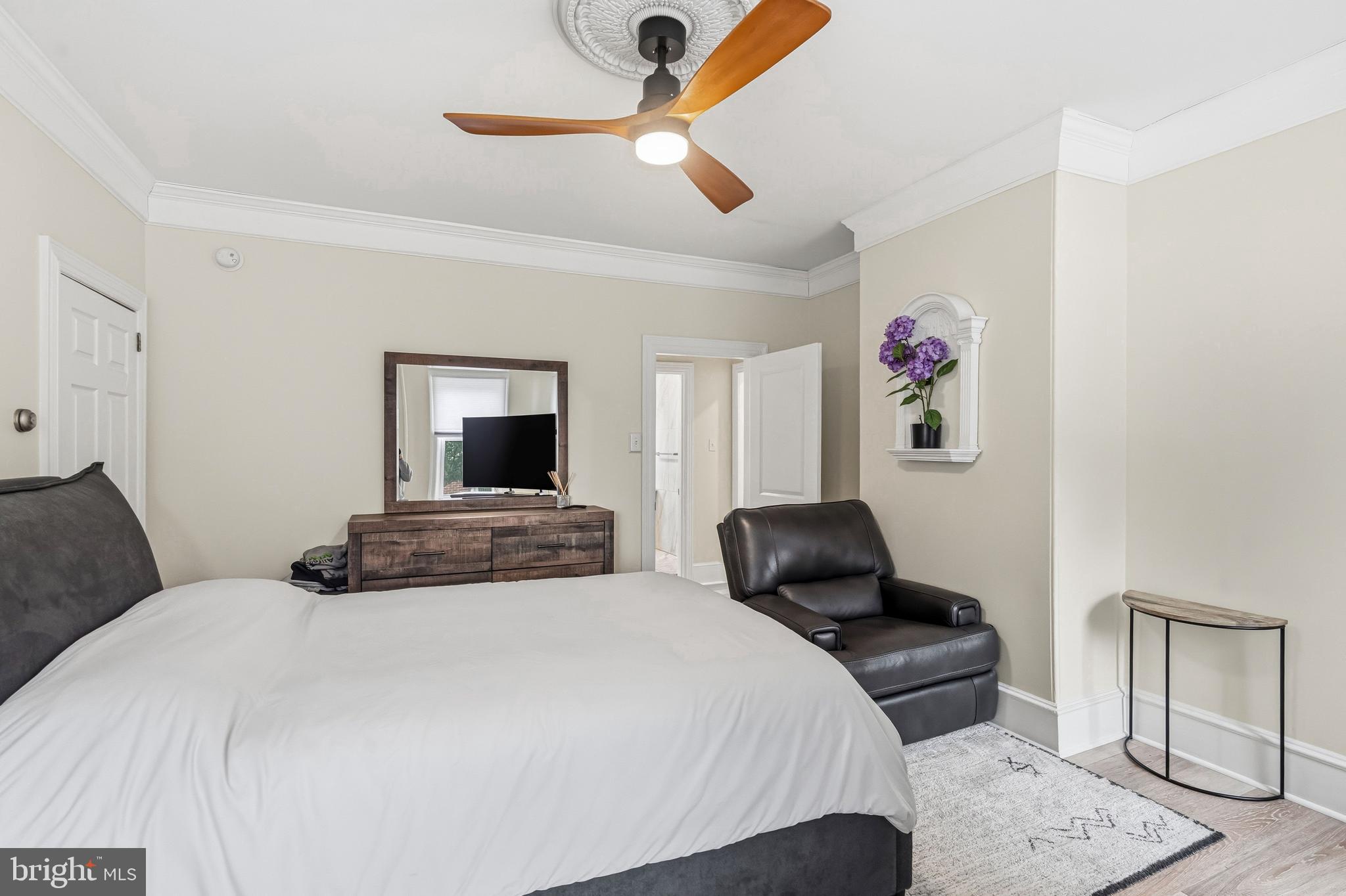 213 South Church Street Moorestown, NJ 08057 - Photo 13 of 54 a bedroom with a bed and a chandelier
