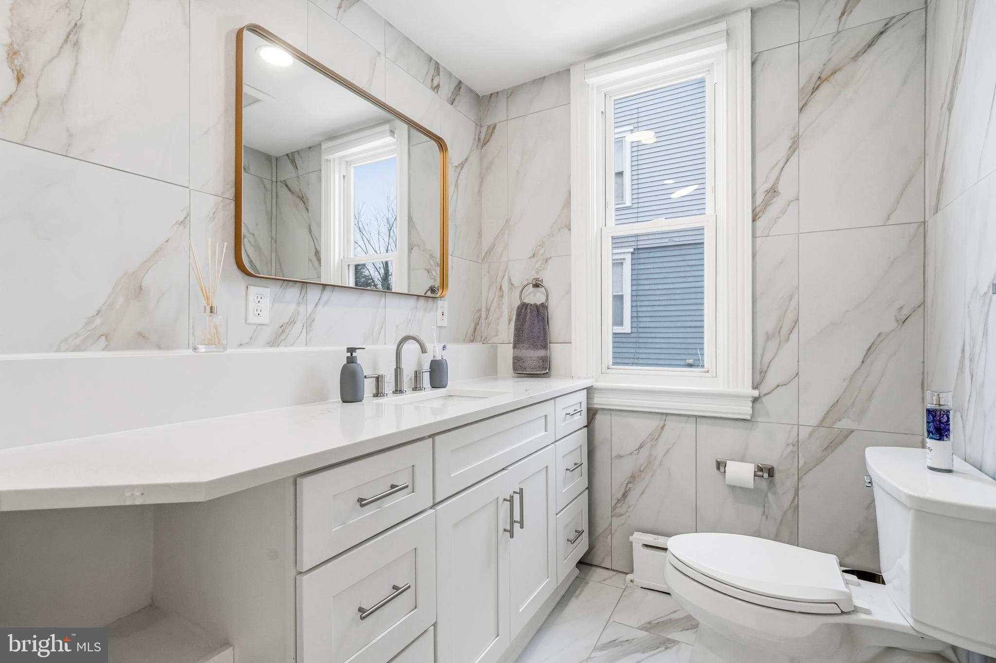213 South Church Street Moorestown, NJ 08057 - Photo 17 of 54 a bathroom with a sink a toilet and a mirror