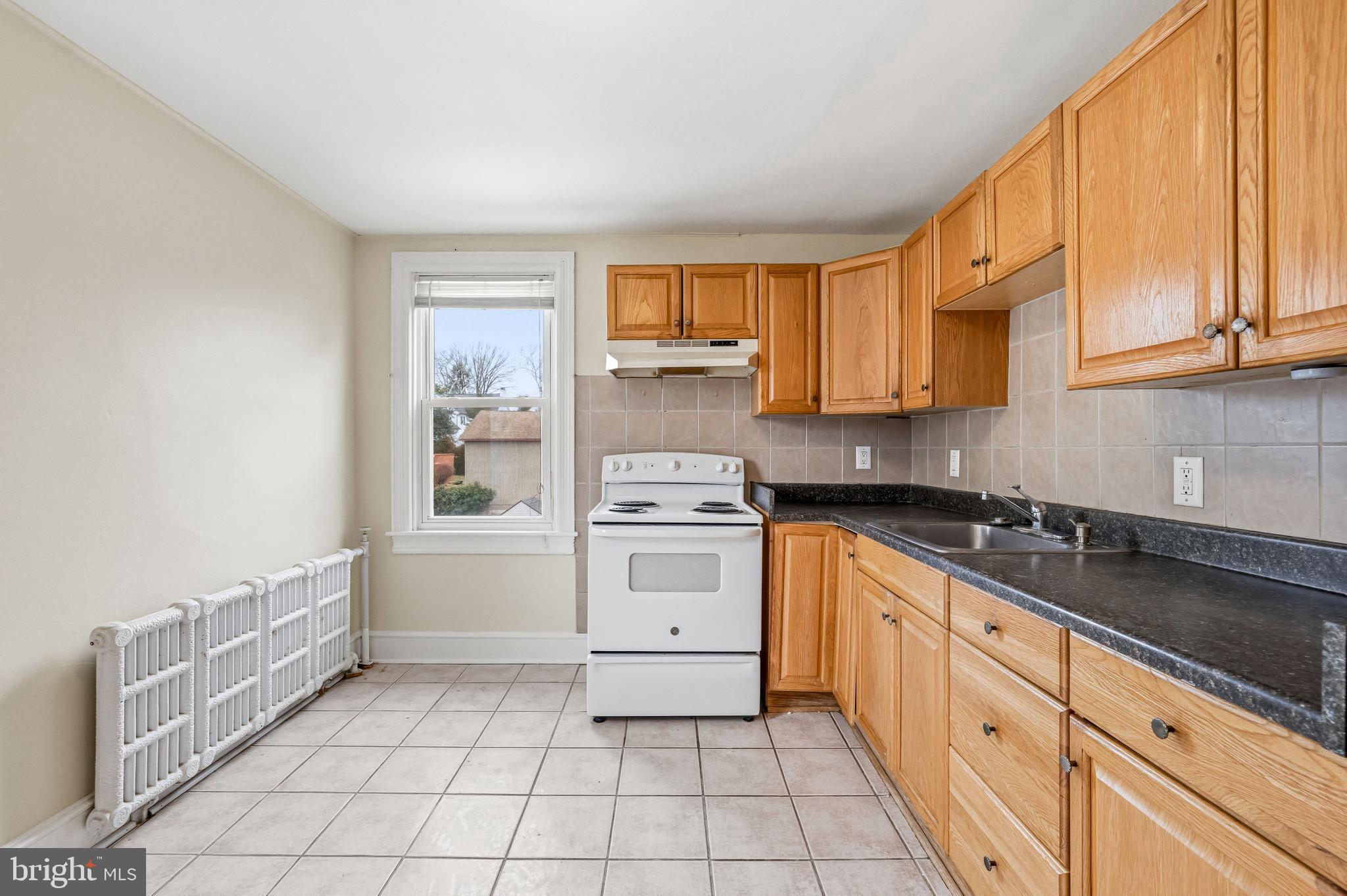 213 South Church Street Moorestown, NJ 08057 - Photo 32 of 54 a kitchen with a stove a sink and a refrigerator