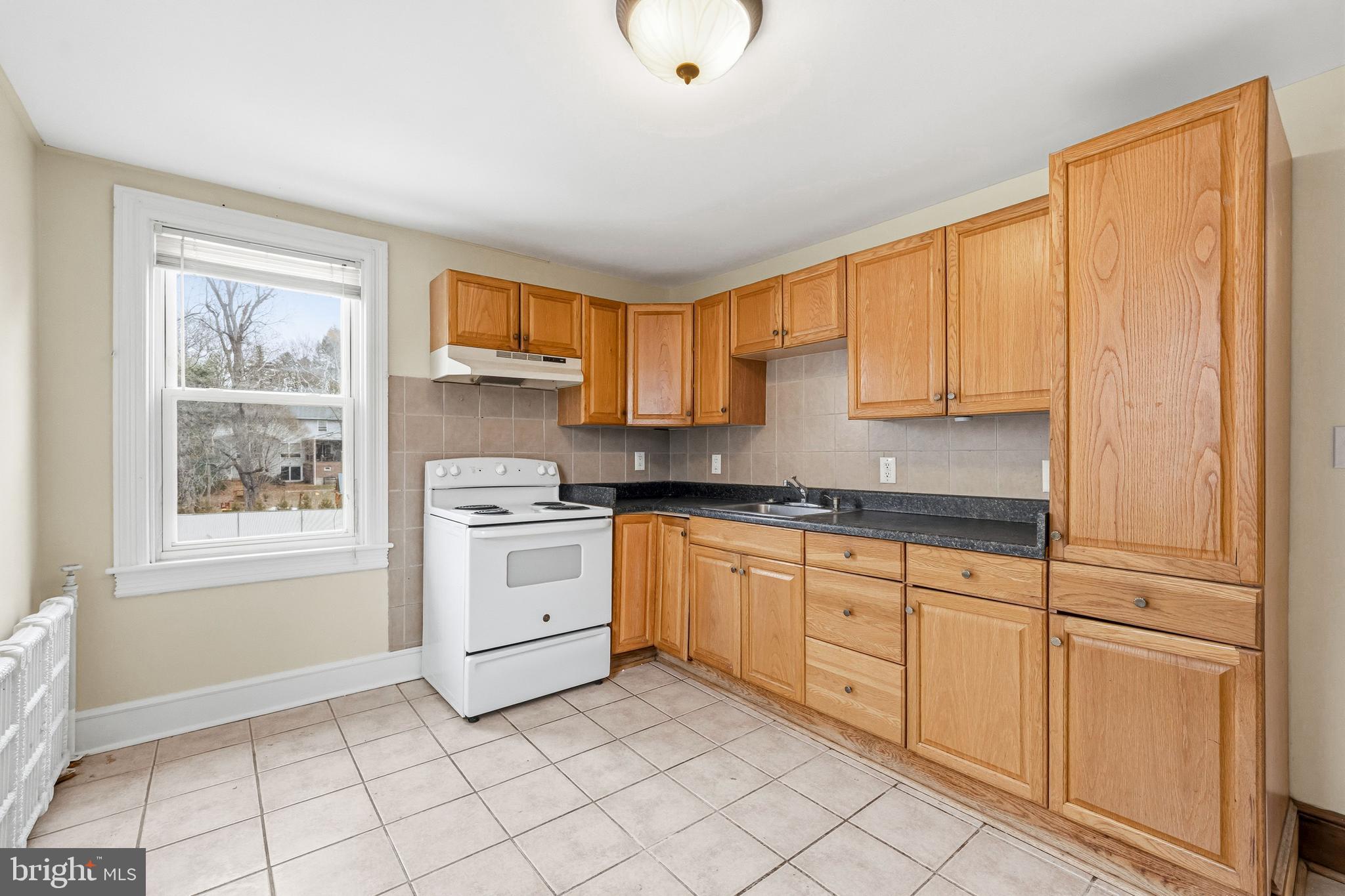 213 South Church Street Moorestown, NJ 08057 - Photo 33 of 54 a kitchen with white cabinets and a window