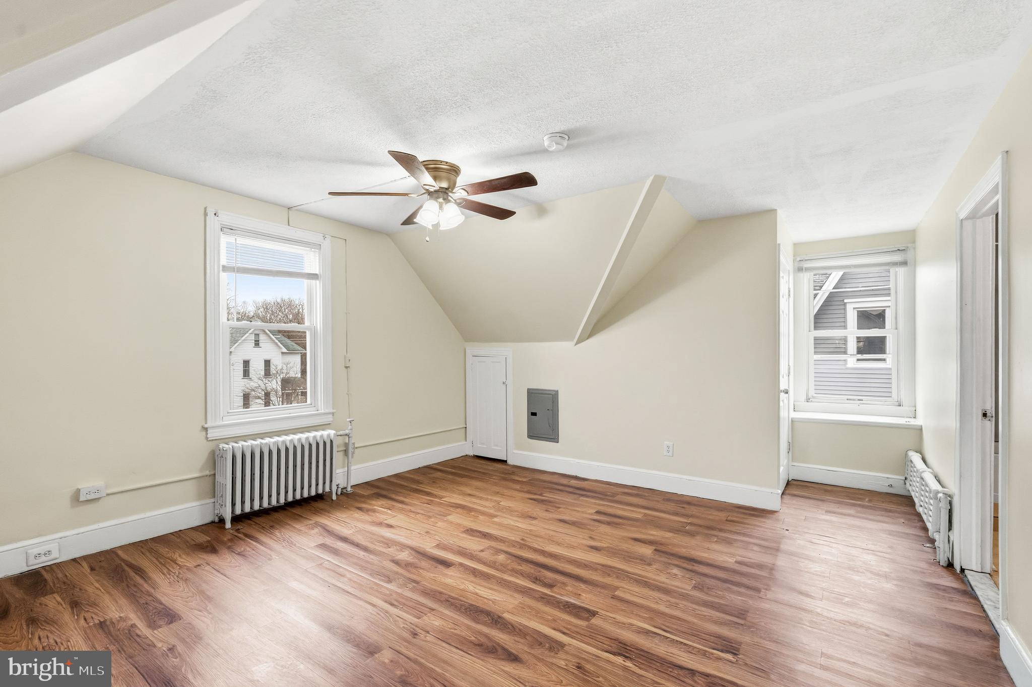 213 South Church Street Moorestown, NJ 08057 - Photo 39 of 54 an empty room with wooden floor chandelier fan and windows