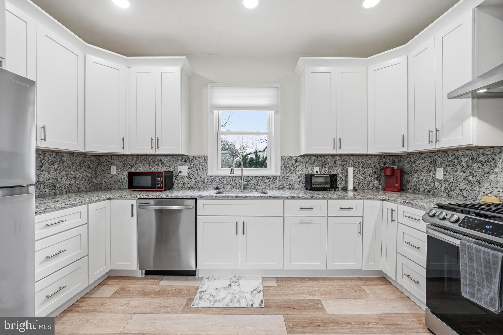 213 South Church Street Moorestown, NJ 08057 - Photo 7 of 54 a kitchen with cabinets appliances and a window