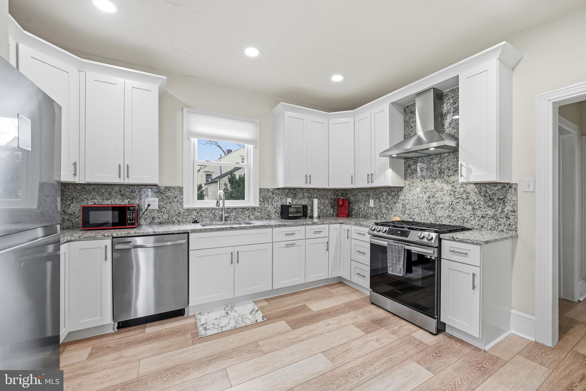 213 South Church Street Moorestown, NJ 08057 - Photo 8 of 54 a kitchen with granite countertop white cabinets and appliances