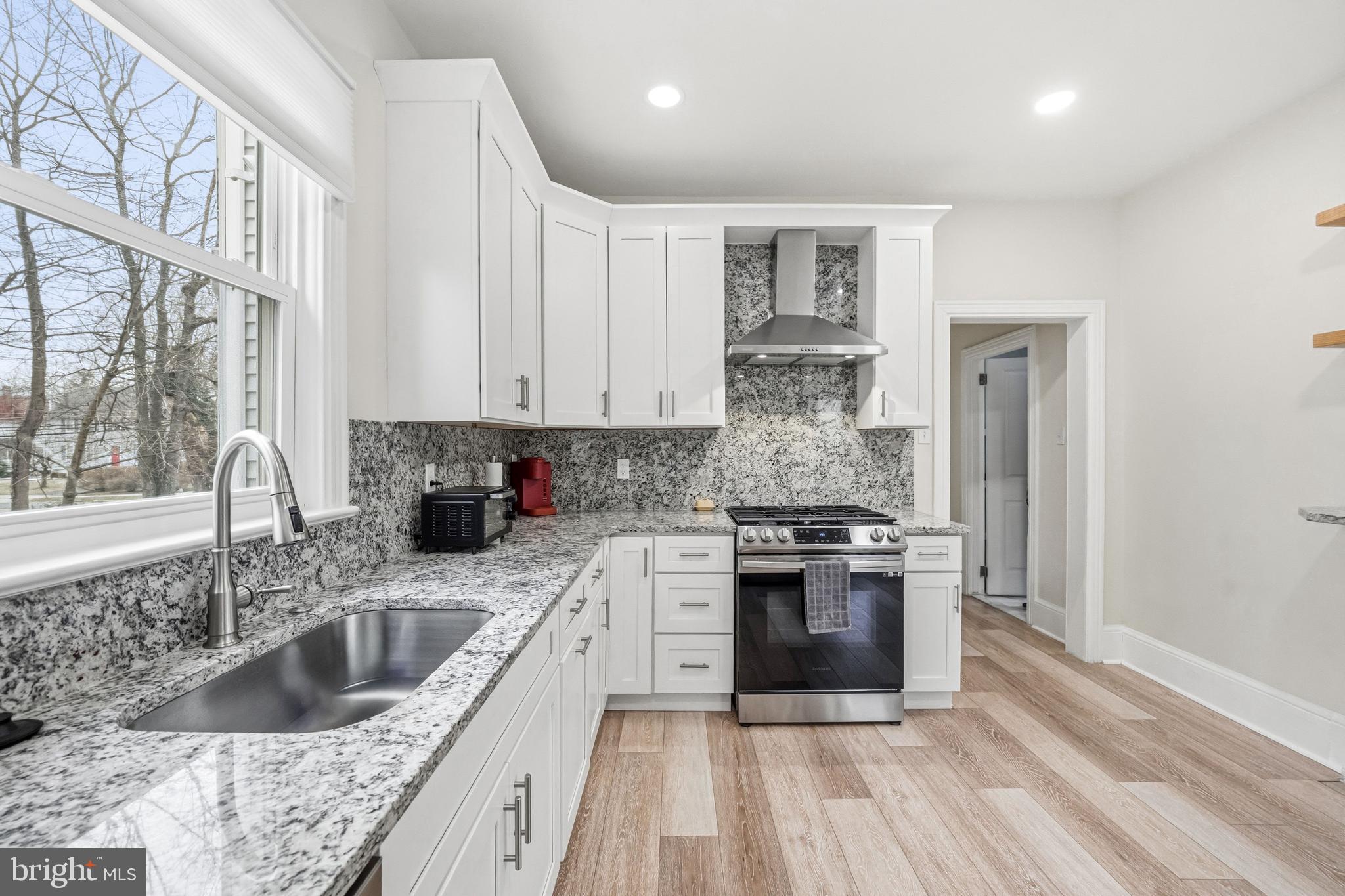 213 South Church Street Moorestown, NJ 08057 - Photo 9 of 54 a kitchen with stainless steel appliances granite countertop a stove a sink and a granite counter tops