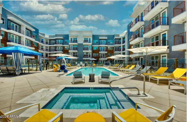 a view of a swimming pool with sitting area