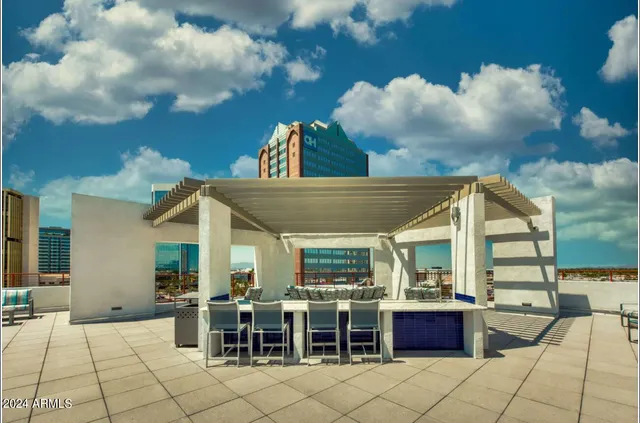 a view of a dinning table and chairs in the patio