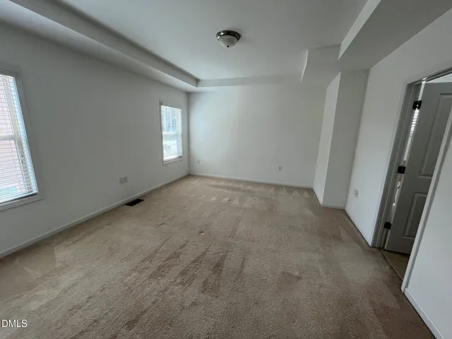 a bathroom with a granite countertop sink a mirror and a shower