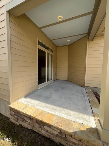 a view of backyard with wooden floor and window