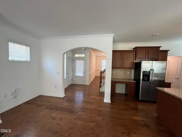a view of a kitchen with a sink refrigerator and a stove