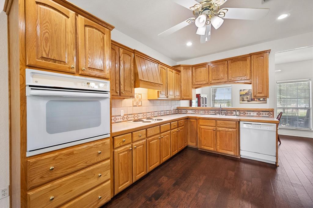 13021 Rudy's Way Streetman, TX 75859 - Photo 8 of 40 Spacious kitchen near Richland Chambers Lake with wood cabinetry, tile backsplash, and plenty of counter space.