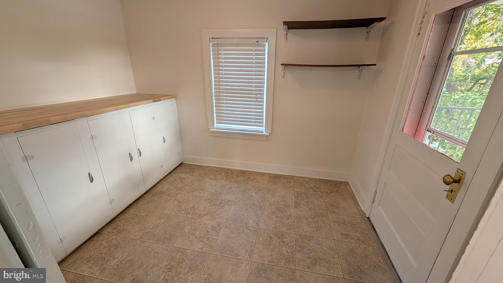 302 Leidy Road, Unit 2 Souderton, PA 18964 - Photo 13 of 23 a view of a utility room with a window and a hallway