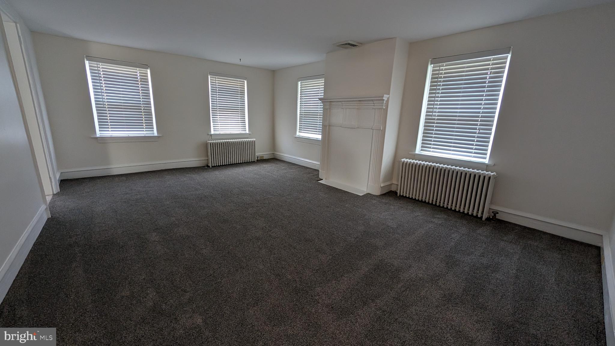 302 Leidy Road, Unit 2 Souderton, PA 18964 - Photo 15 of 23 a view of empty room with windows