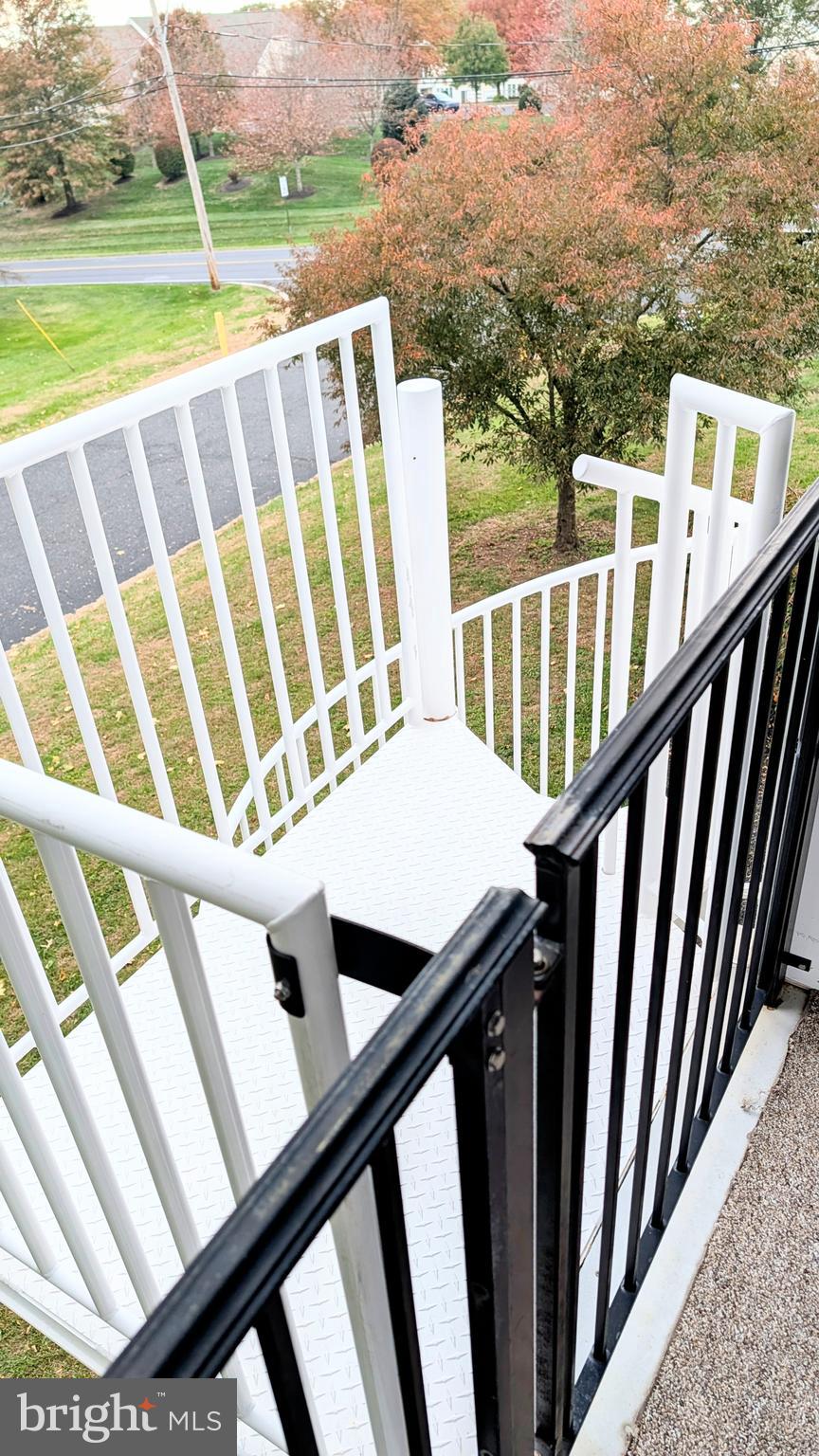 302 Leidy Road, Unit 2 Souderton, PA 18964 - Photo 19 of 23 a view of a balcony with wooden floor and yard