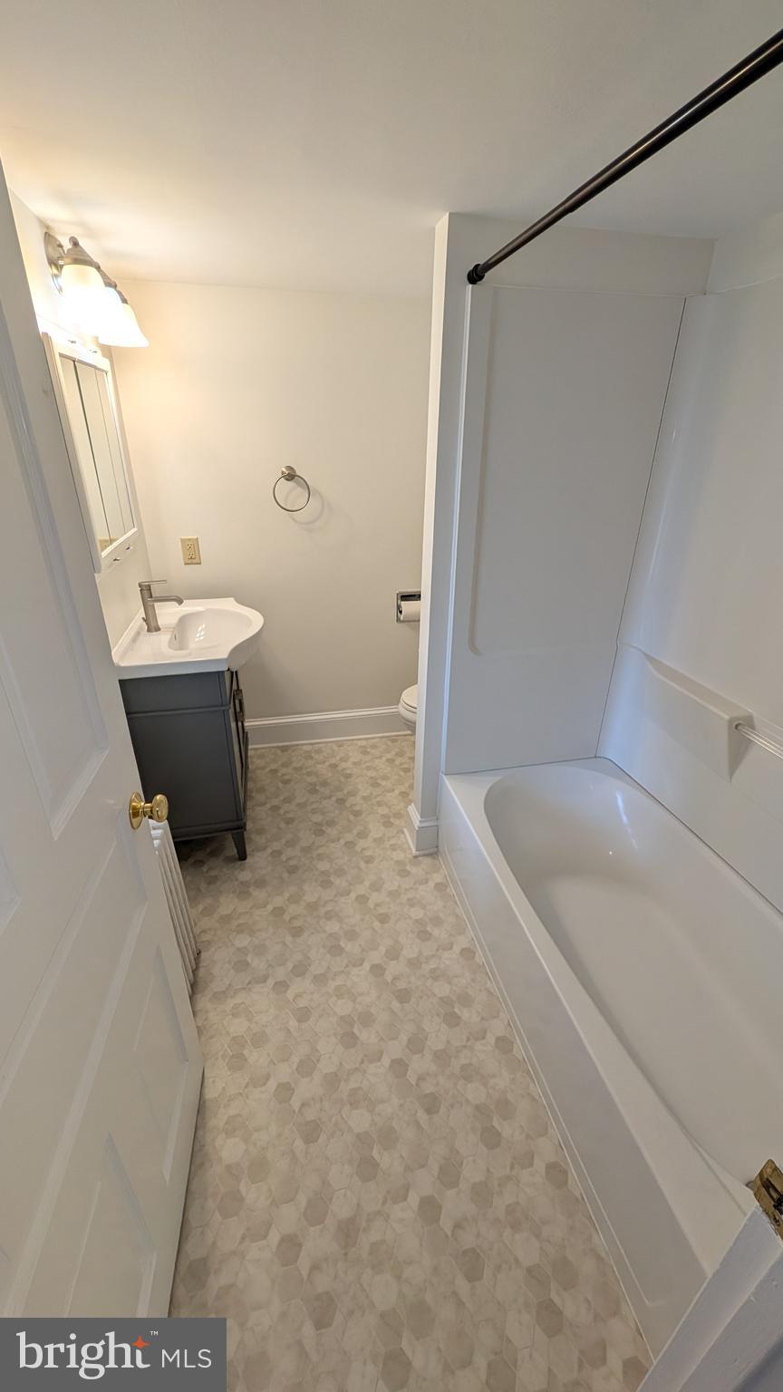 302 Leidy Road, Unit 2 Souderton, PA 18964 - Photo 10 of 23 a bathroom with a sink a toilet and shower