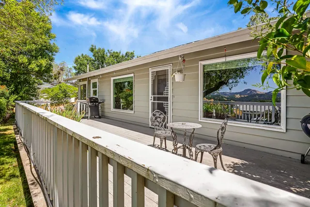 a view of house with backyard and garden