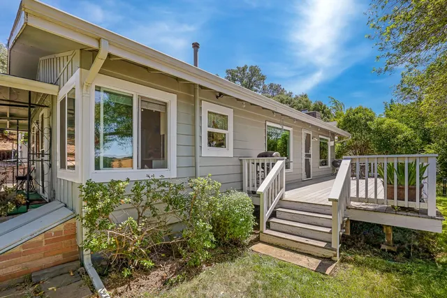 a backyard of a house with lots of green space