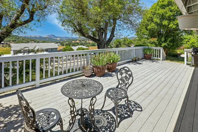 a view of a backyard with sitting area