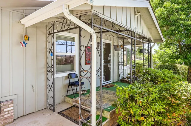 a kitchen with kitchen island granite countertop a sink stove and refrigerator