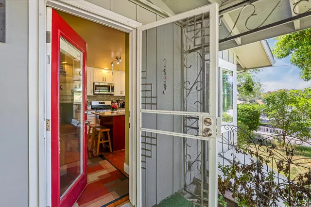 a kitchen with stainless steel appliances granite countertop a stove a refrigerator and a microwave