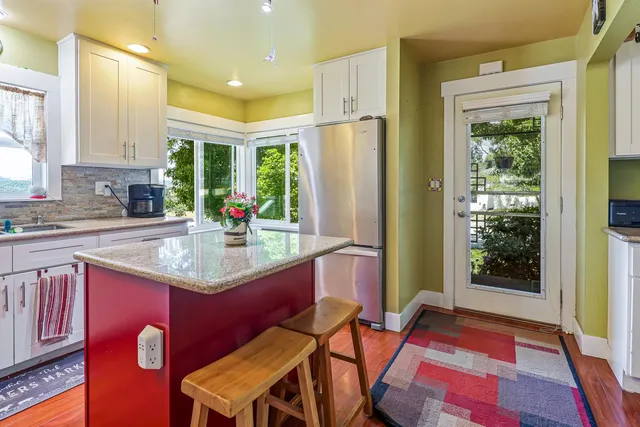 a view of a livingroom with furniture and a fireplace
