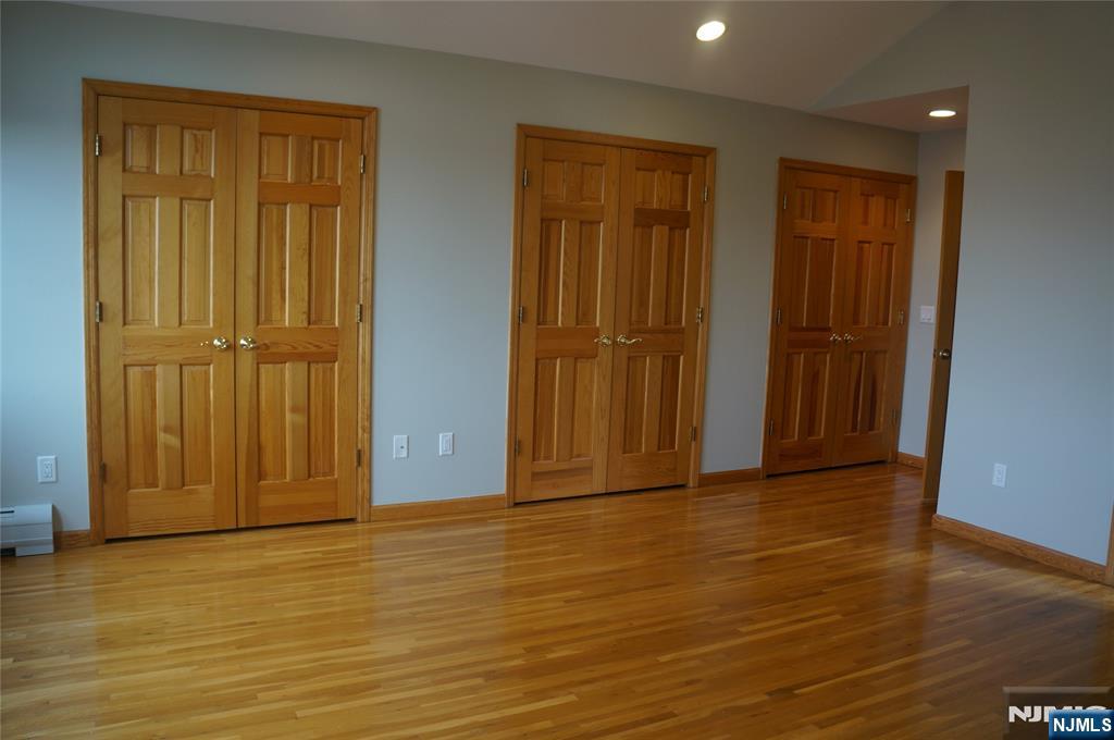520 7th Street, Unit B Palisades Park, NJ 07650 - Photo 16 of 22 an empty room with wooden floor and closet area