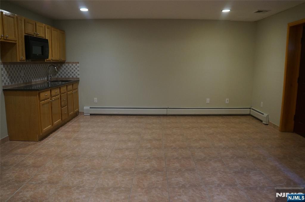 520 7th Street, Unit B Palisades Park, NJ 07650 - Photo 19 of 22 a view of a kitchen with an empty space and a window